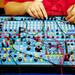 Lansing resident Brian Adams adjusts and plugs in chords  in a 1980 electronic educator during the Mini Maker Faire on Saturday, June 8. Daniel Brenner I AnnArbor.com